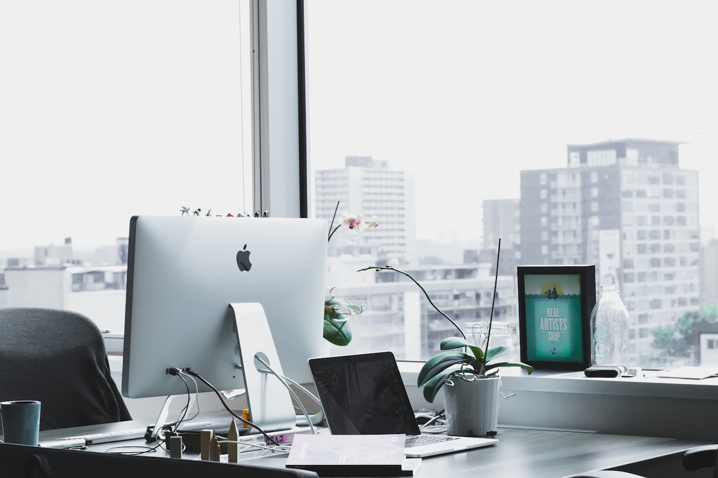 Remote worker with laptop at home office setup