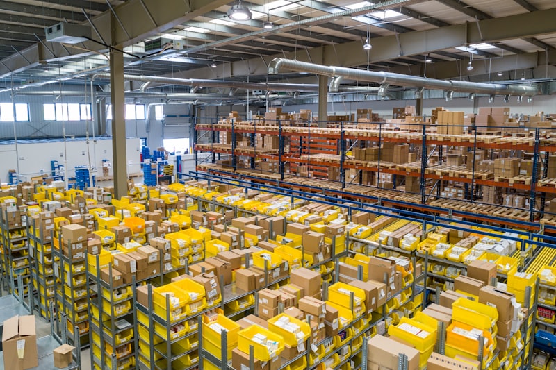 Packages being sorted at a logistics warehouse facility for distribution.